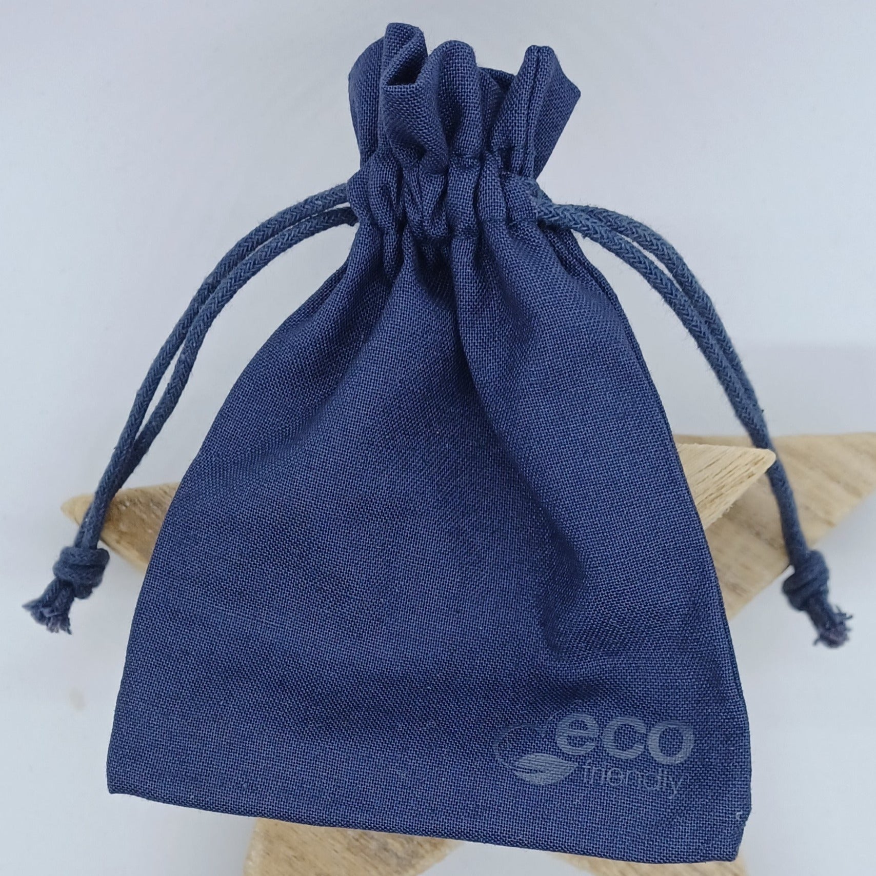 Eco-friendly gift bag. Dark blue gift bag with a drawstring closure.