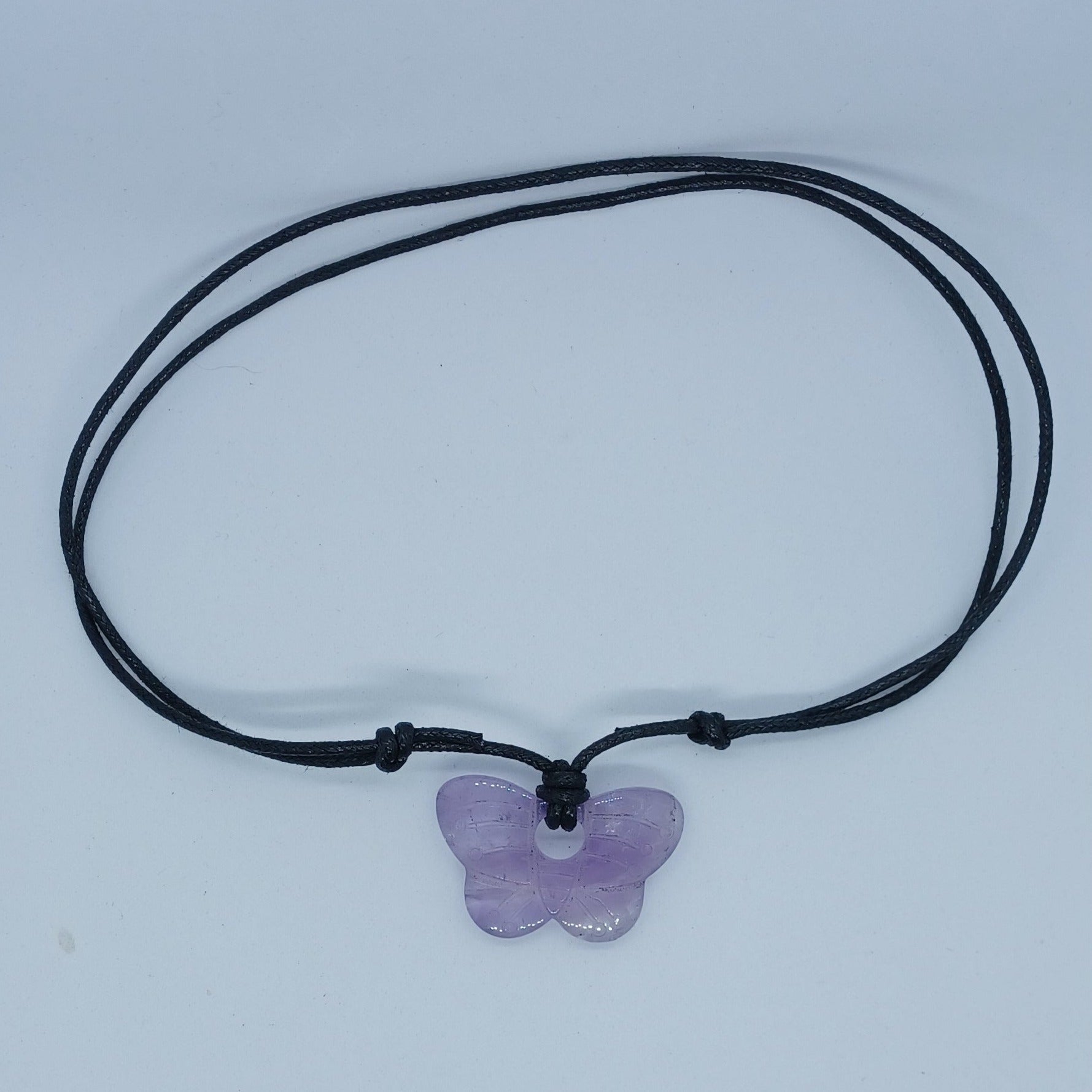 Amethyst butterfly necklace shown at it's shortest length. 