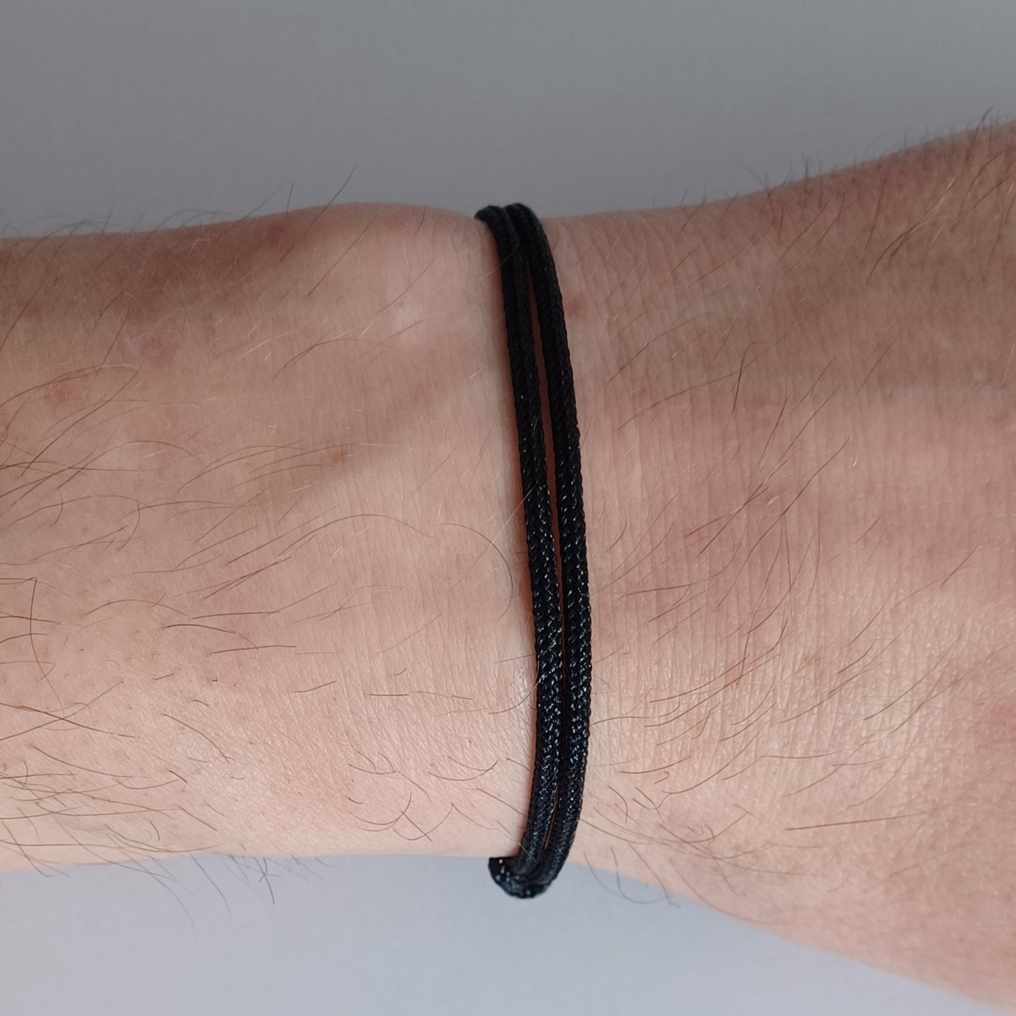 Black cord bracelet with sliding knots