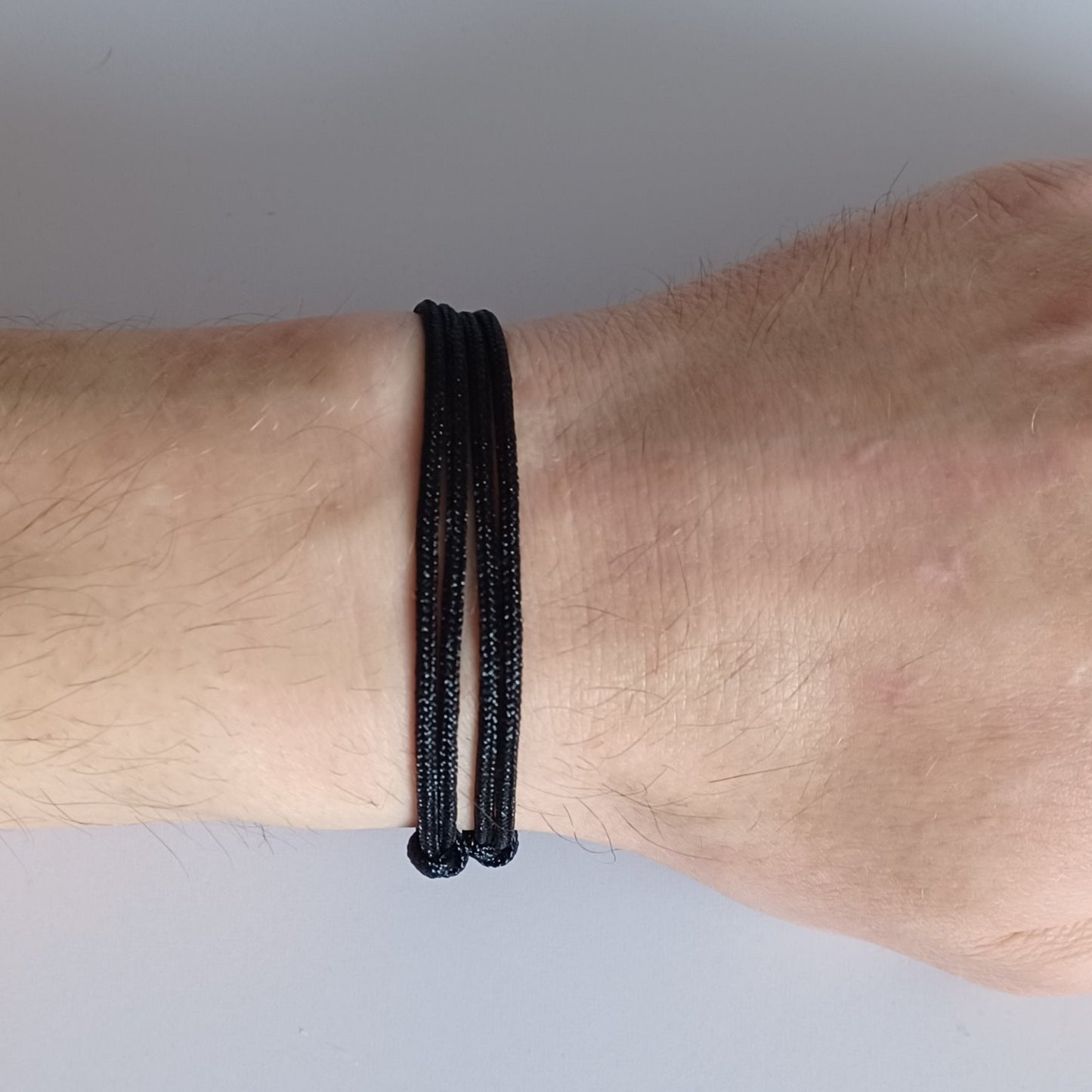 Black cord bracelet with sliding knots