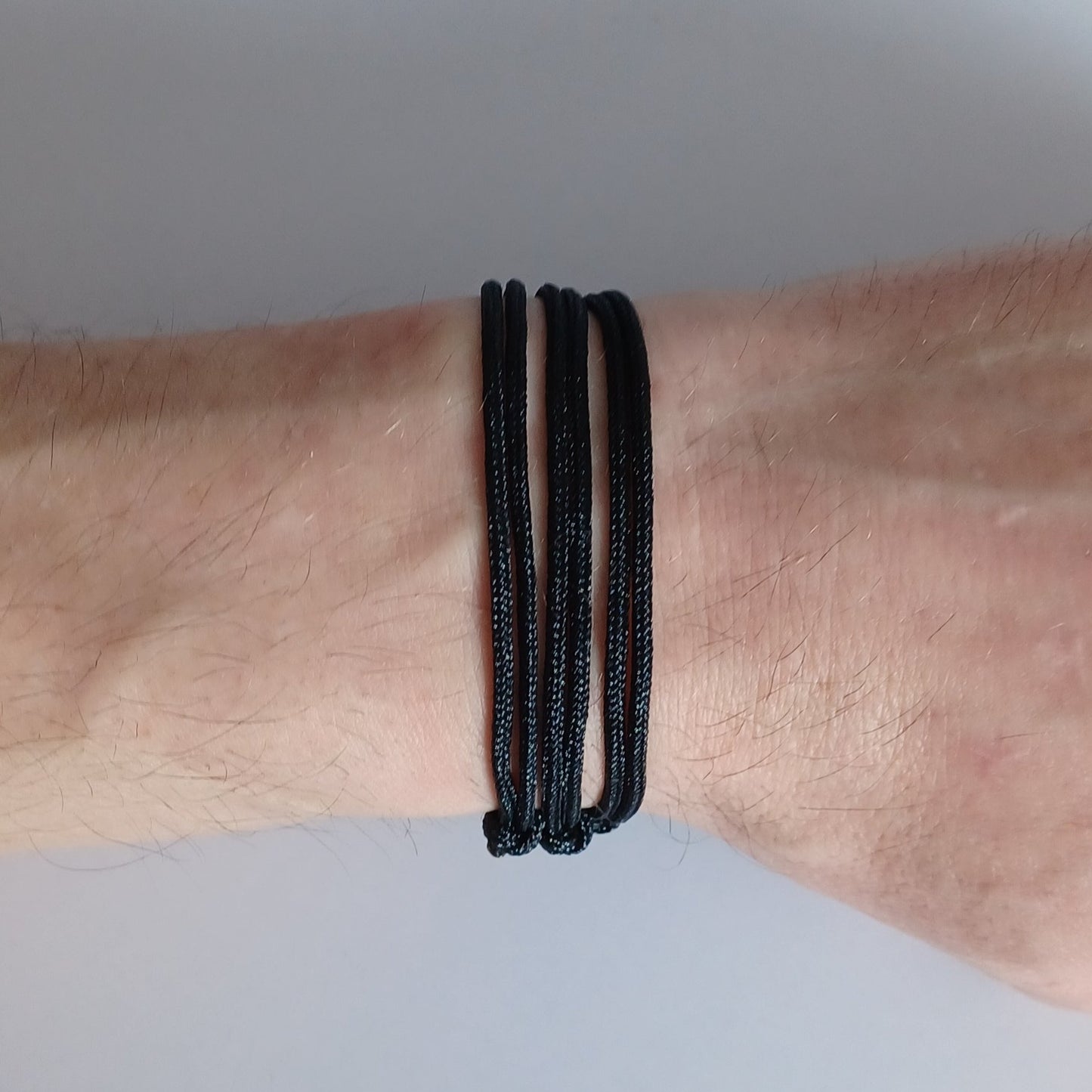 Black cord bracelet with sliding knots