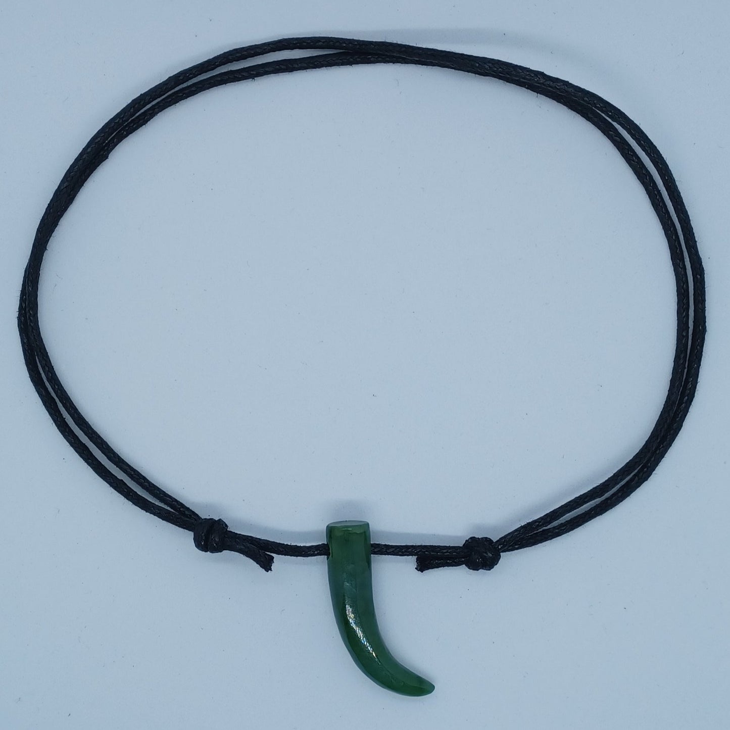 Jade horn shaped cord necklace